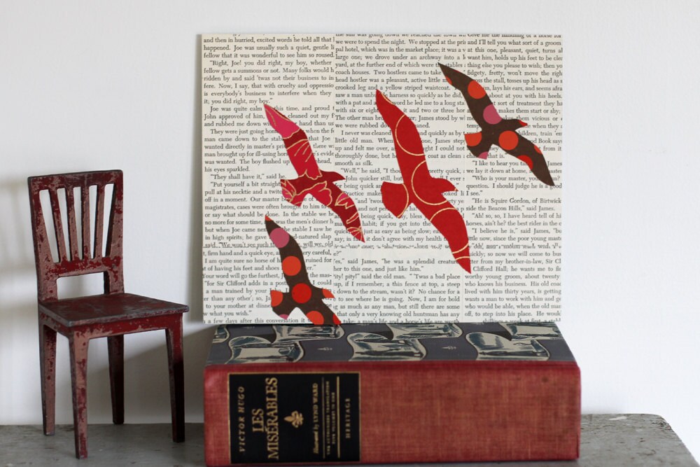 Birds in flight over books