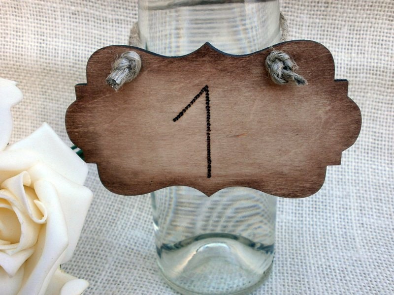 These very rustic engraved wood table numbers would be a great addition to