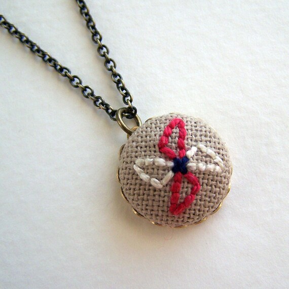 Red Pinwheel Necklace Embroidered White and Brown Pendant on an Antique Brass Chain