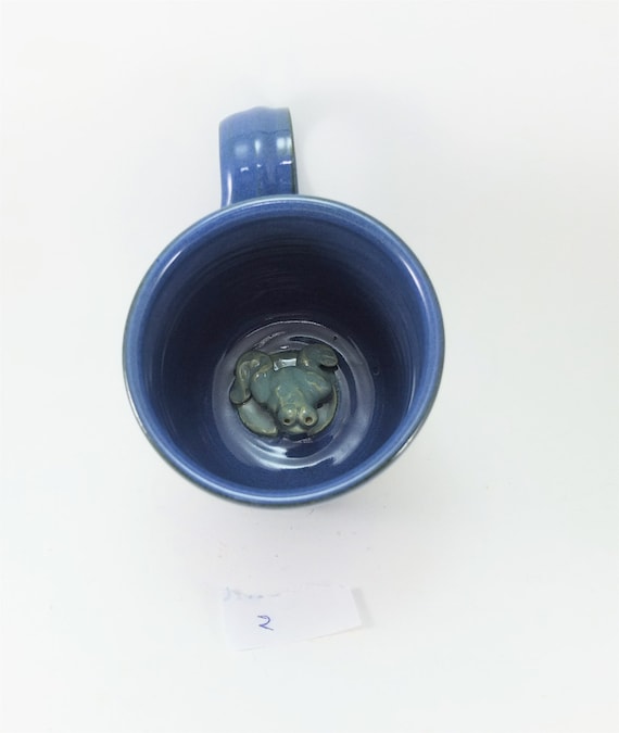 frog on the bottom of a mug