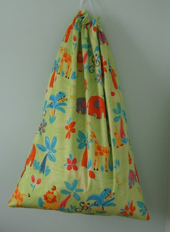 Giant toy storage bag featuring cheerful jungle animals